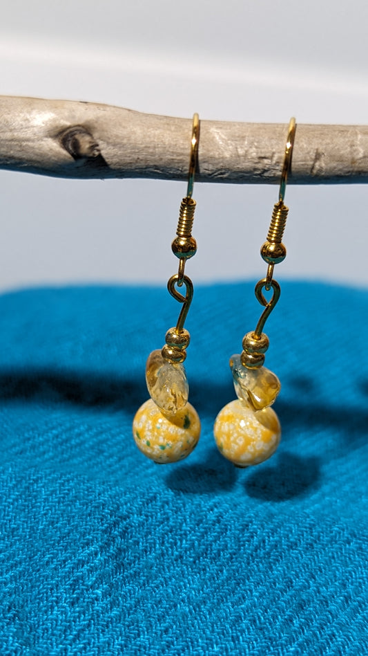 Yellow gem/crystal earrings.