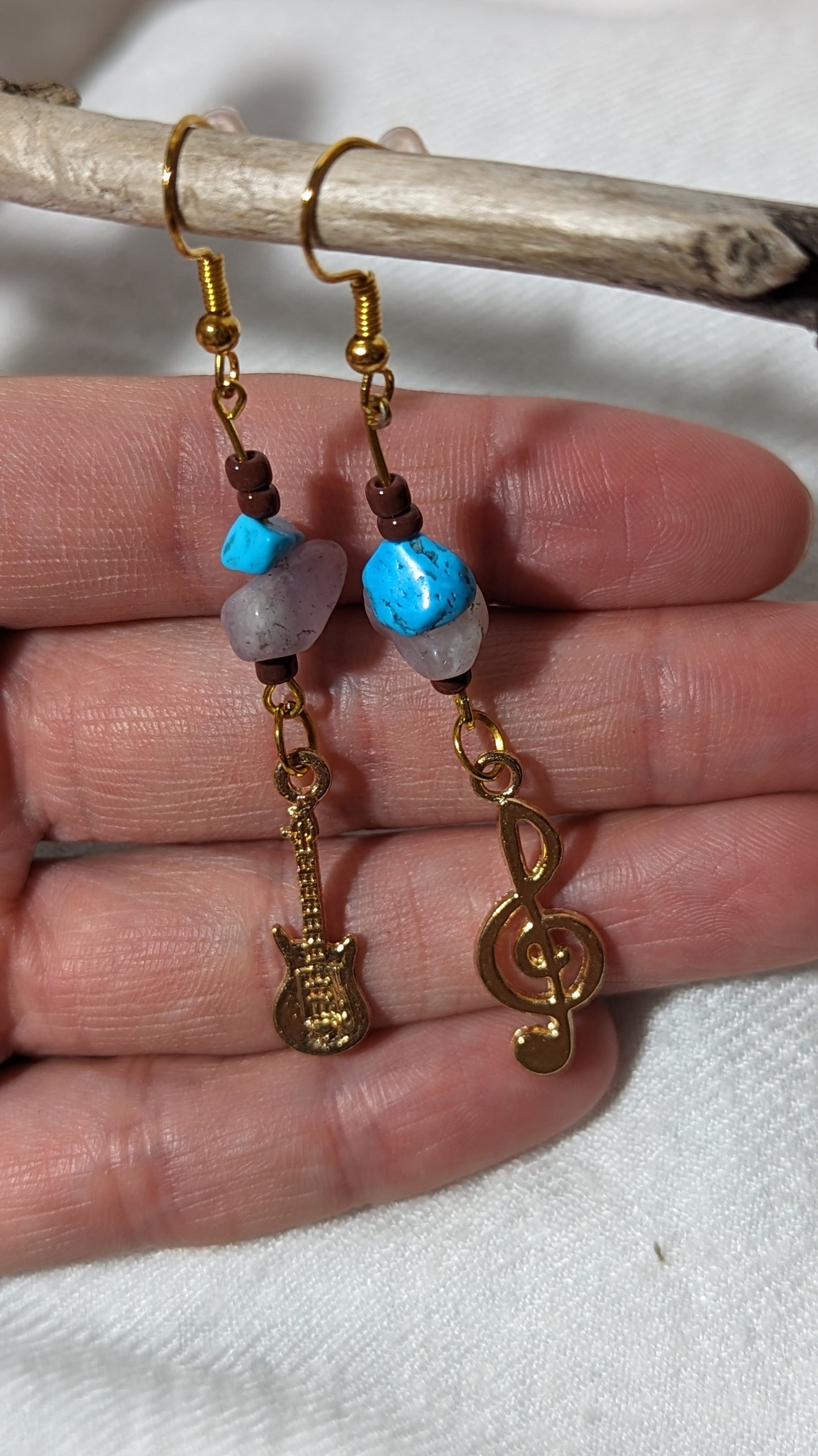 Blue/pink gemstone earrings with “musical theme” pendant