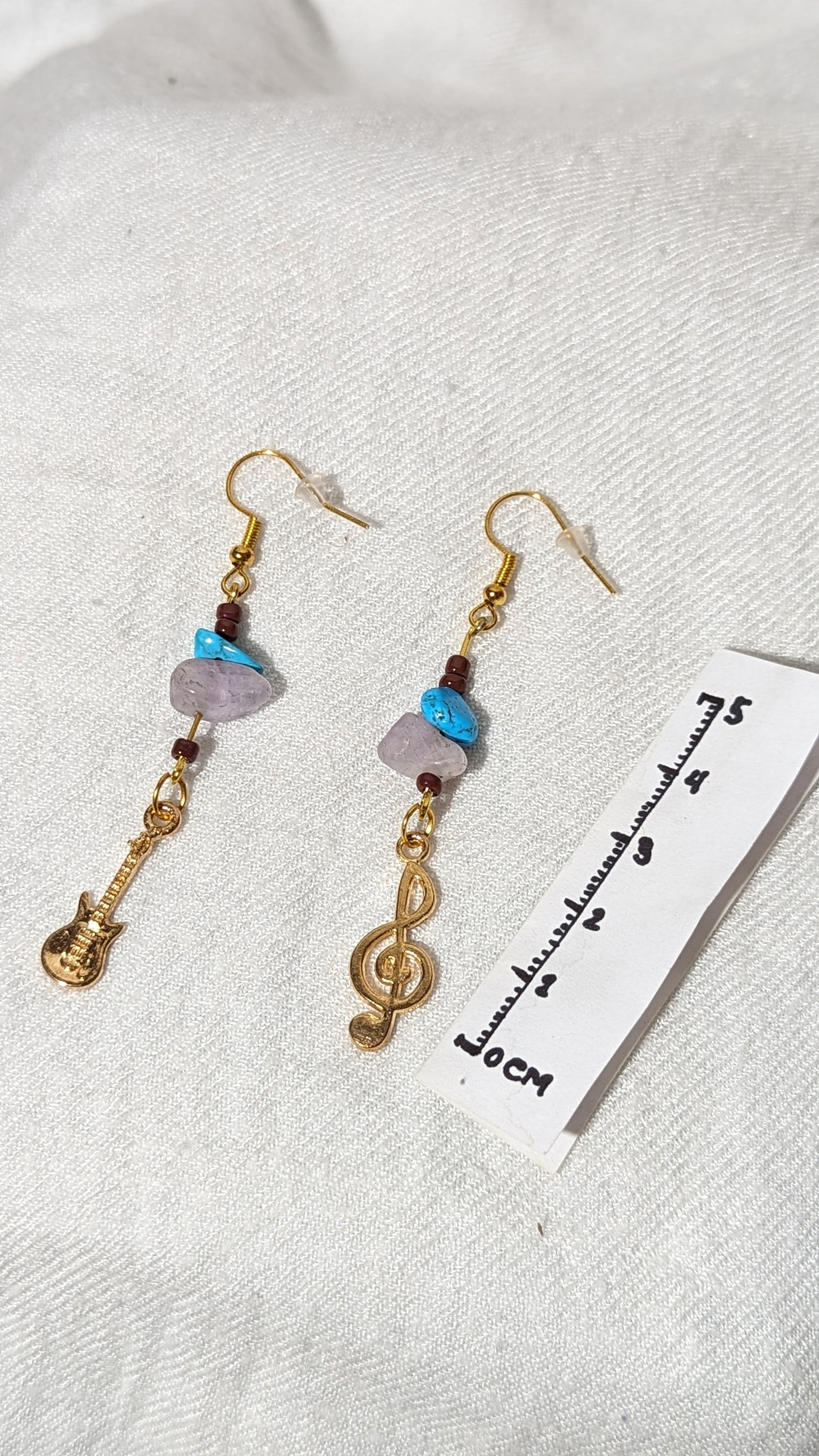 Blue/pink gemstone earrings with “musical theme” pendant